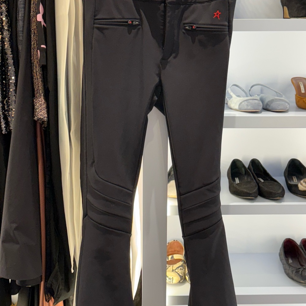 PERFECT MOMENT AURORA SKI PANTS Black Flared Pants with Red Star Detail
